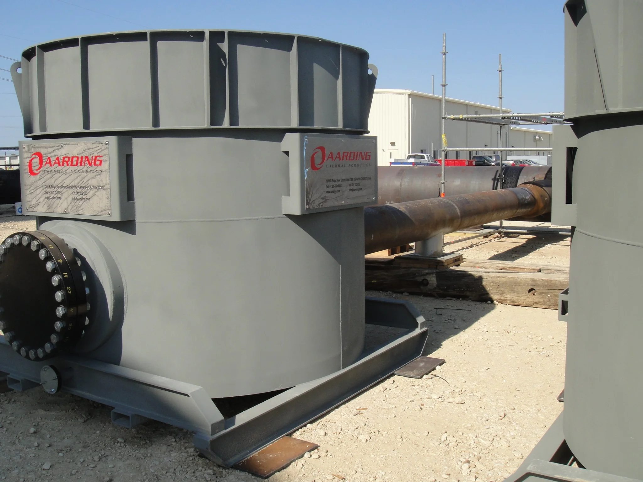 Commissioning silencer outside of industrial building.
