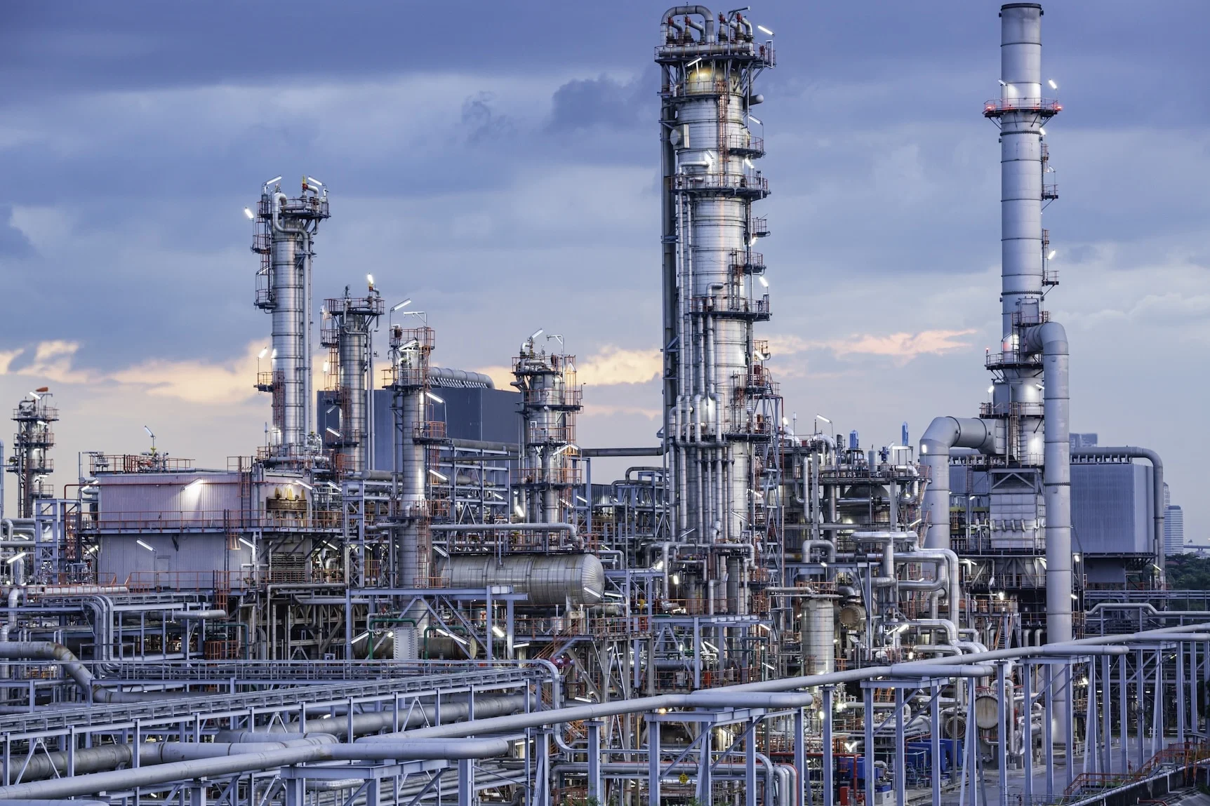 Oil​ refinery ​and​ plant tower column refinery of petrochemistry industry in oil​ and​ gas​ ​industry with​ cloud​ blue​ ​sky cloud the twilight.